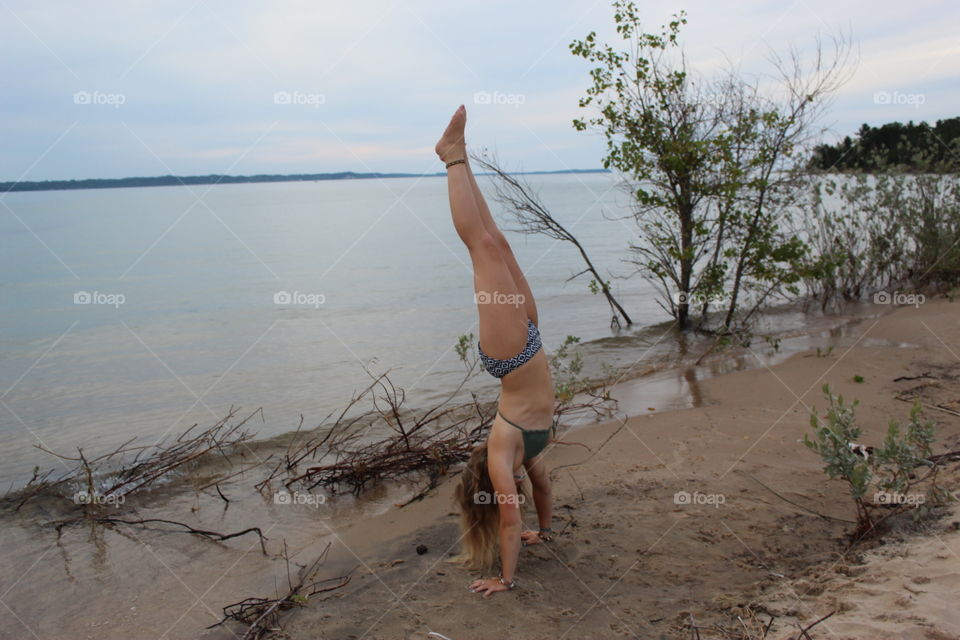 Nothing like a handstand on the damp sand with the lake behind you. I was a gymnast for 8 years but I’ve lost the correct form since. That doesn’t matter when you’re having fun!