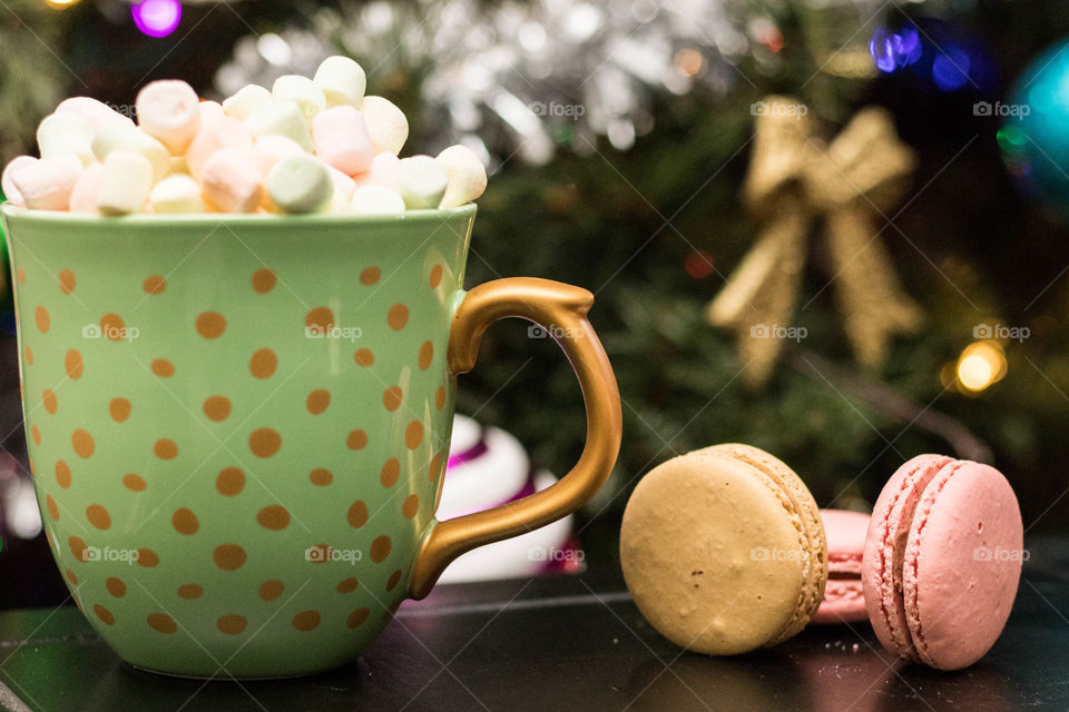 Hot Chocolate with marshmallows and Macarons by the Christmas tree