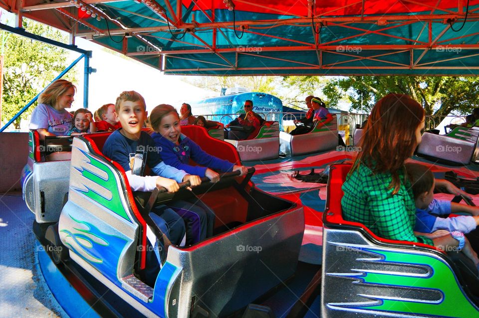 People ride at amusement park