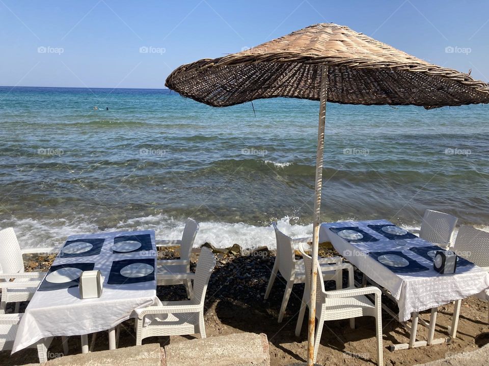 Dinner with a view. Breakfast with a view. Lunch. Sunny holidays I’m Turkey. Walk in the cute city and charming streets by the beach in Kusadasi. perfect blue sky and ocean view. Beach and the shore. To travel is to live. Gorgeous tall palm trees.