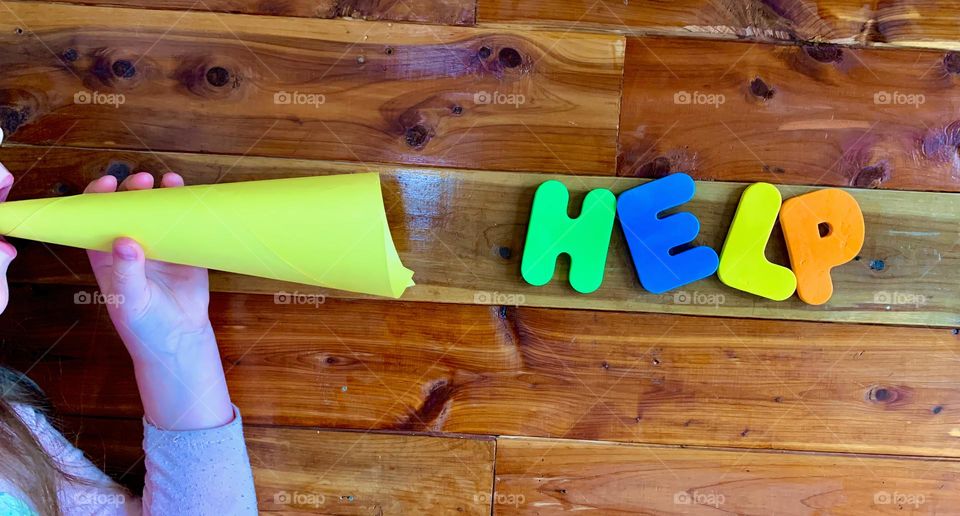 Calling For Help From Child Portraying The Call With Letters On Wooden Wall 