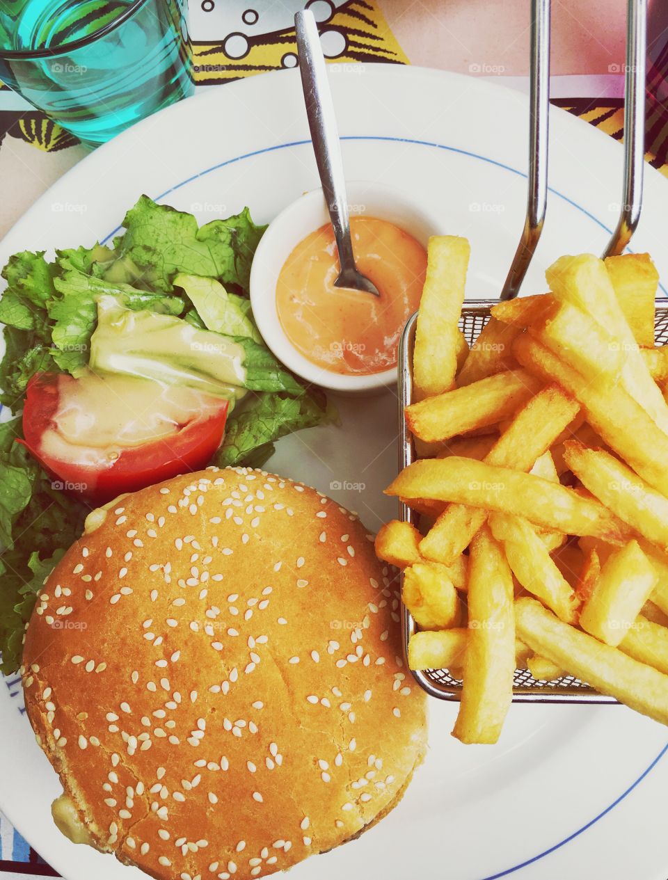 Delicious hamburger with fries on the table, for lunch 