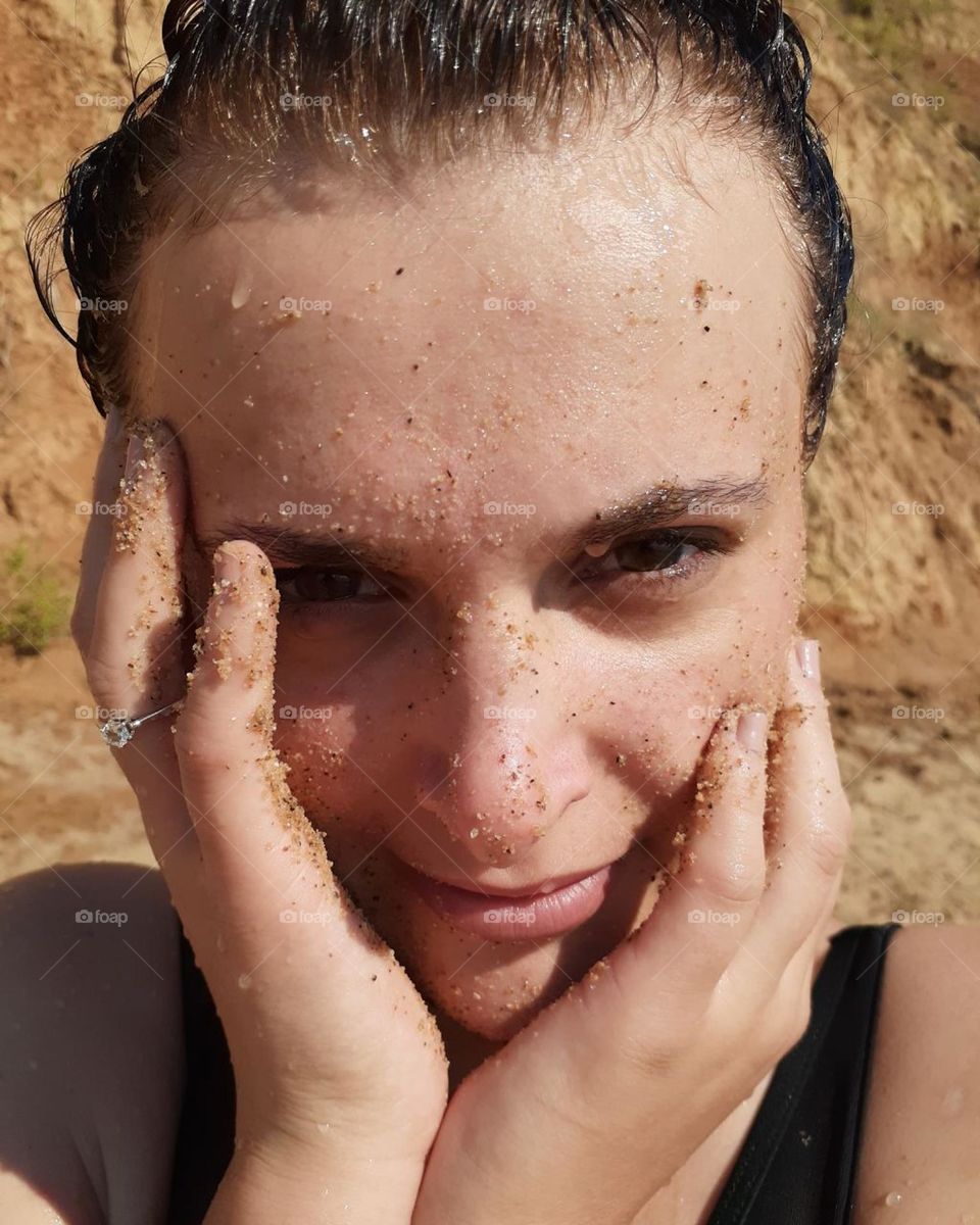 portrait of a white-skinned girl with brown eyes while resting on the beach near the sea