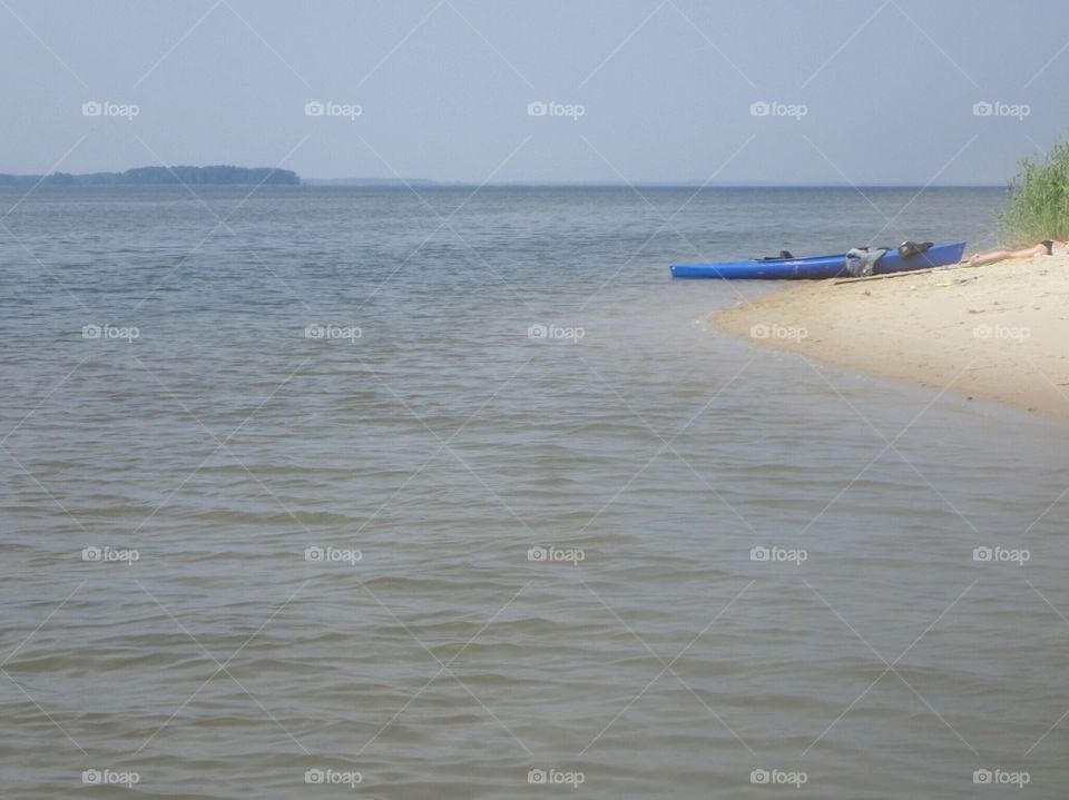 Kayak on hazy day at the beach