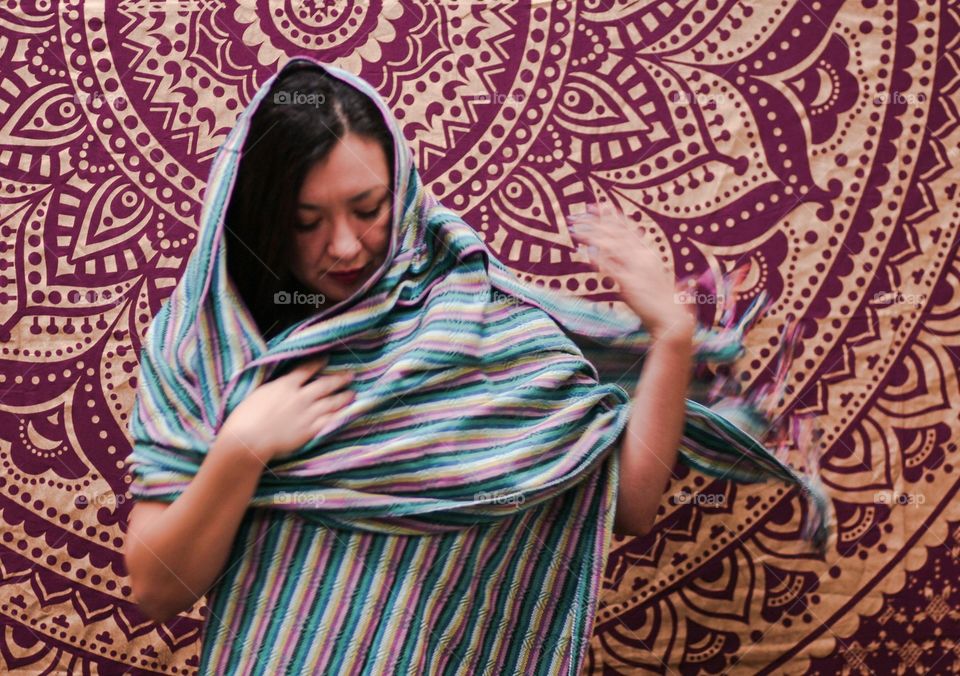 woman wearing traditional mexican rebozo scarf blue stripes