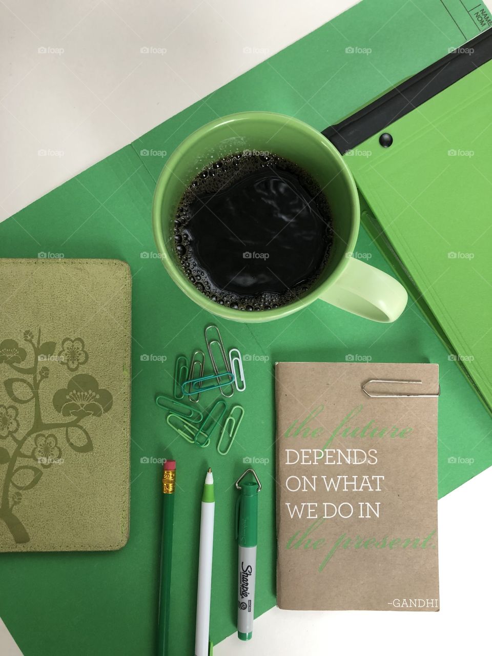 I dream and aligned office near flat lay with a coffee and a motivational quote on a notepad