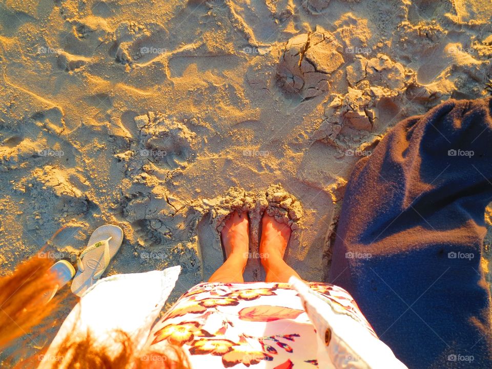 Ni. Burrying my toes in the warm sand at golden hour