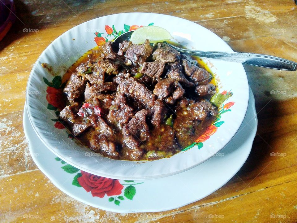 Indonesian beef rendang dis.h originating from Minangkabau. This dish is produced from a long low temperature cooking process using various spices and coconut milk