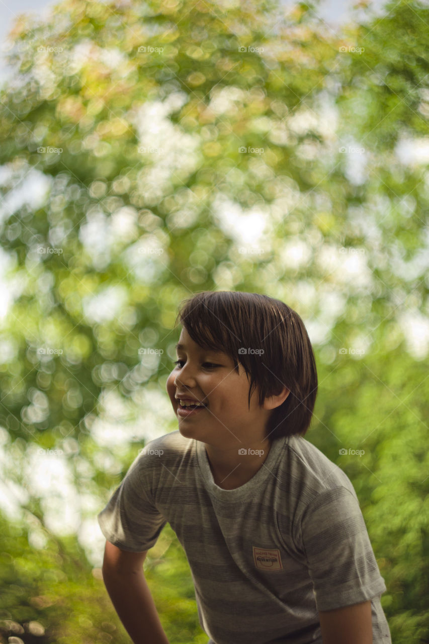 bokehlicious outdoor portrait of a young Eurasian boy