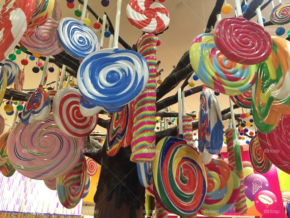 Swirling candy decorations hung upside down 