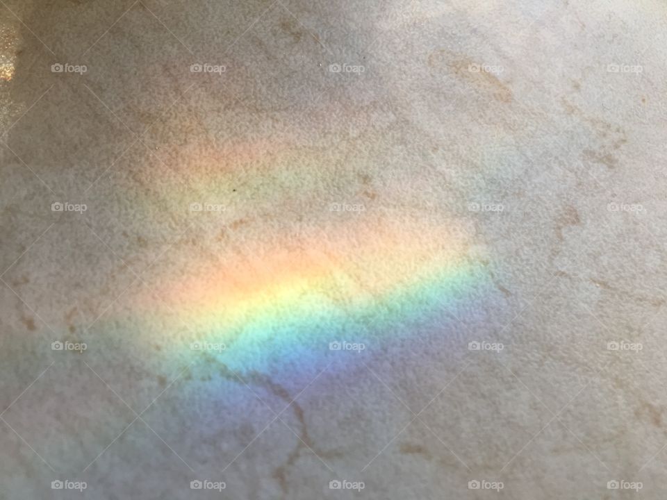 Colorful refraction on a marble surface