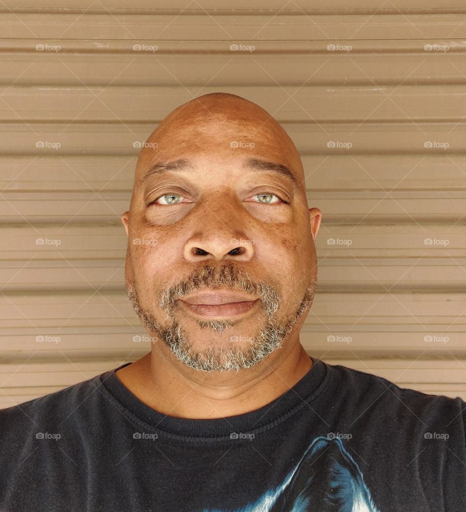 graybeard or no beard that is the question taken with a tan background