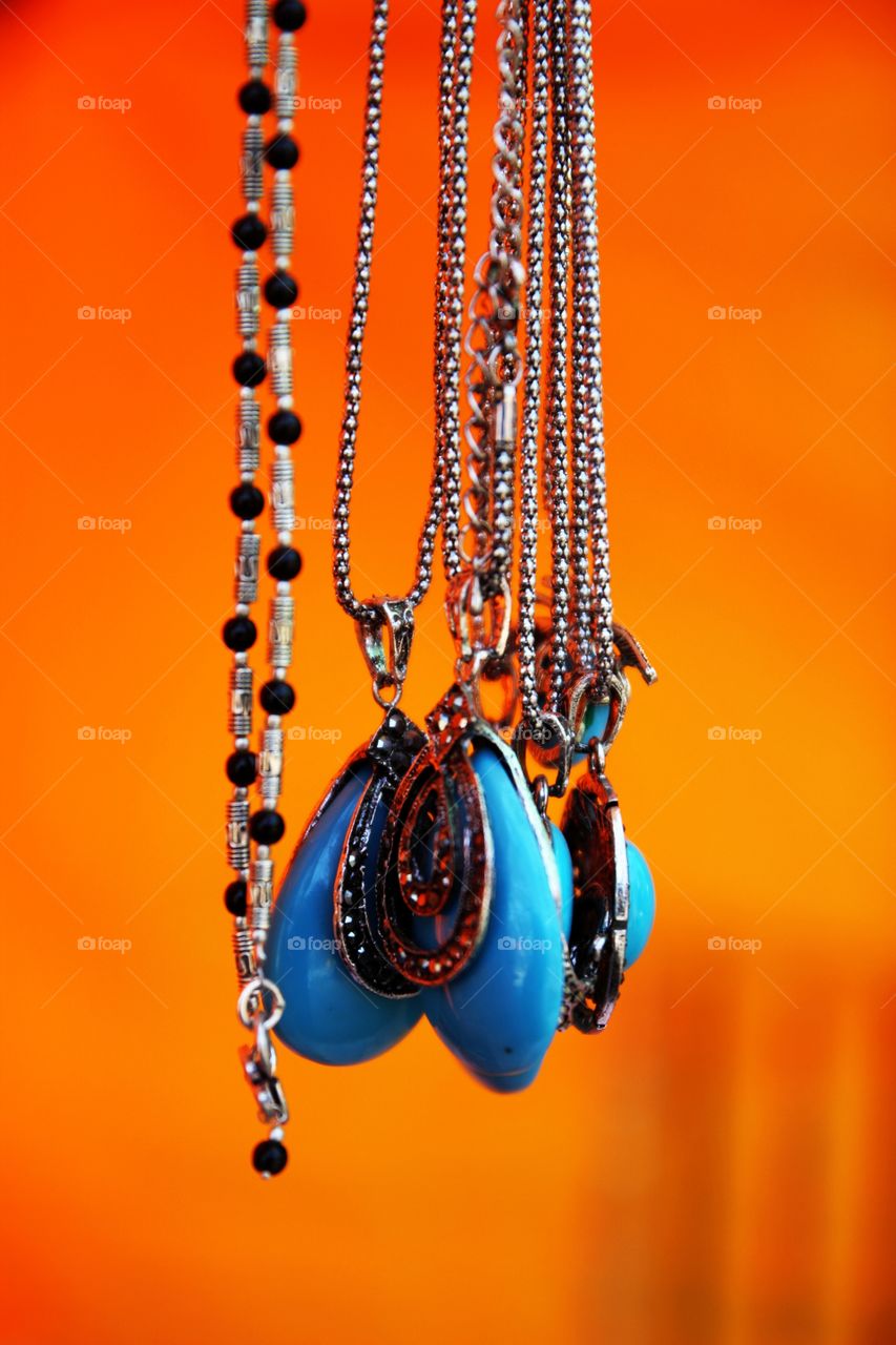 Turquoise Pendant. Turquoise Pendant with Orange Background