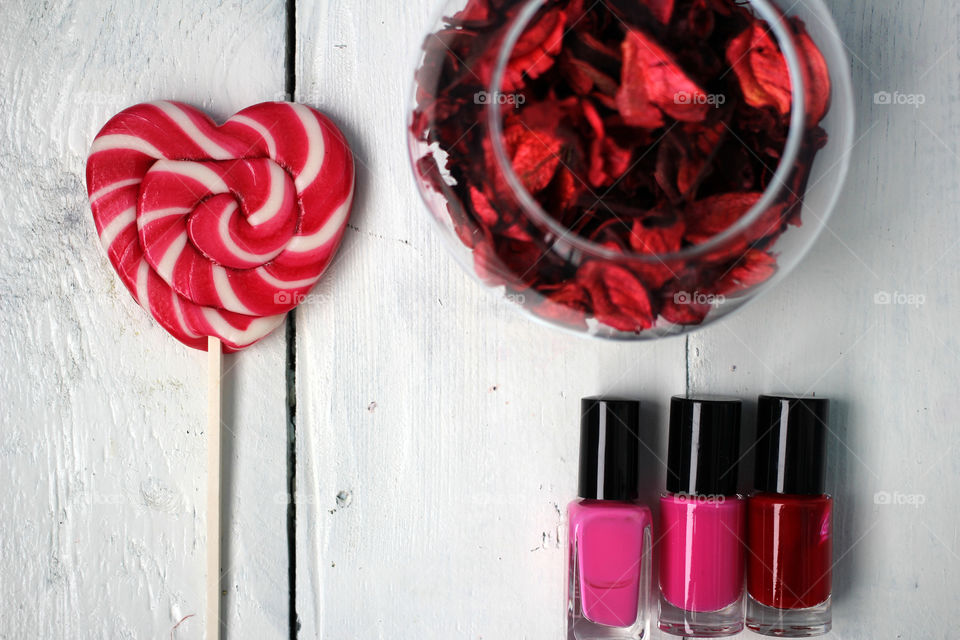 Beauty, health, spa and personal care: nail polish, flowers, rose petals, sweet