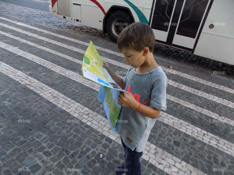 Child reading a map