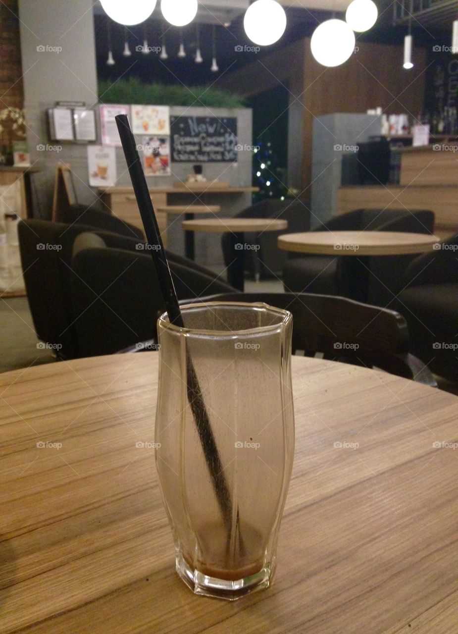 Empty glass in empty cafe 