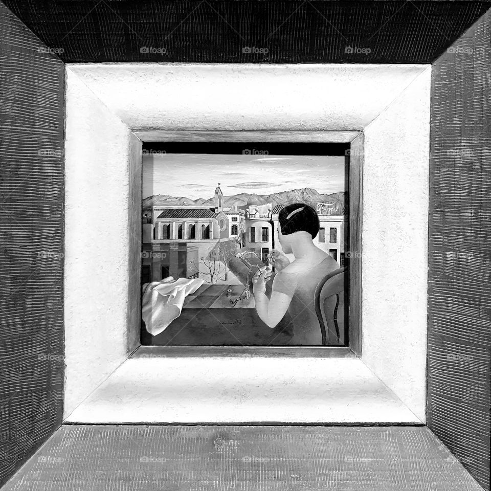 Black and white close-up shot on a vintage painting by Salvador Dali exposed in his Theater Museum in Figueras, Spain