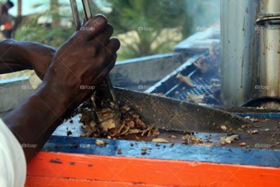 Man preparing food on barbecue