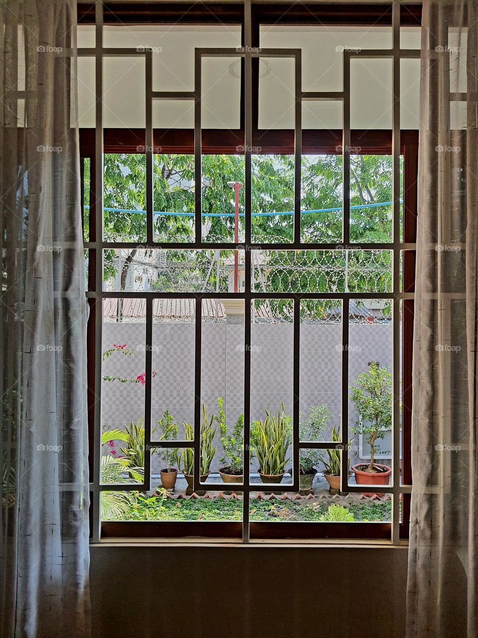 Window with rectangular design iron grill