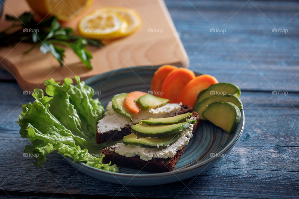 Dietary sandwiches with grain bread, cream cheese and avocado 