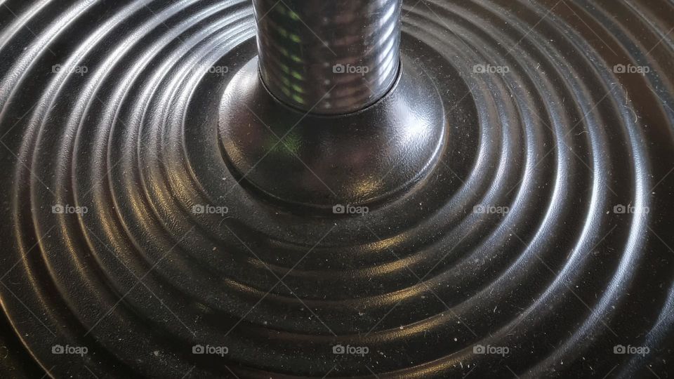 multiple circles in this structure, making up the base of a table.