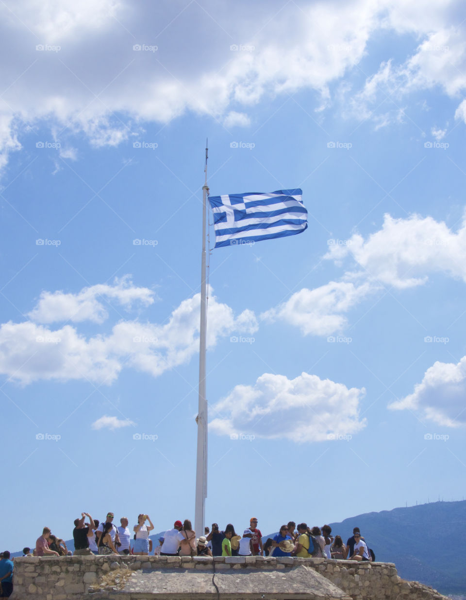 Greek flag on top of the Akropolis at the Parthenon, Athens Greece, Greek Independence Day 