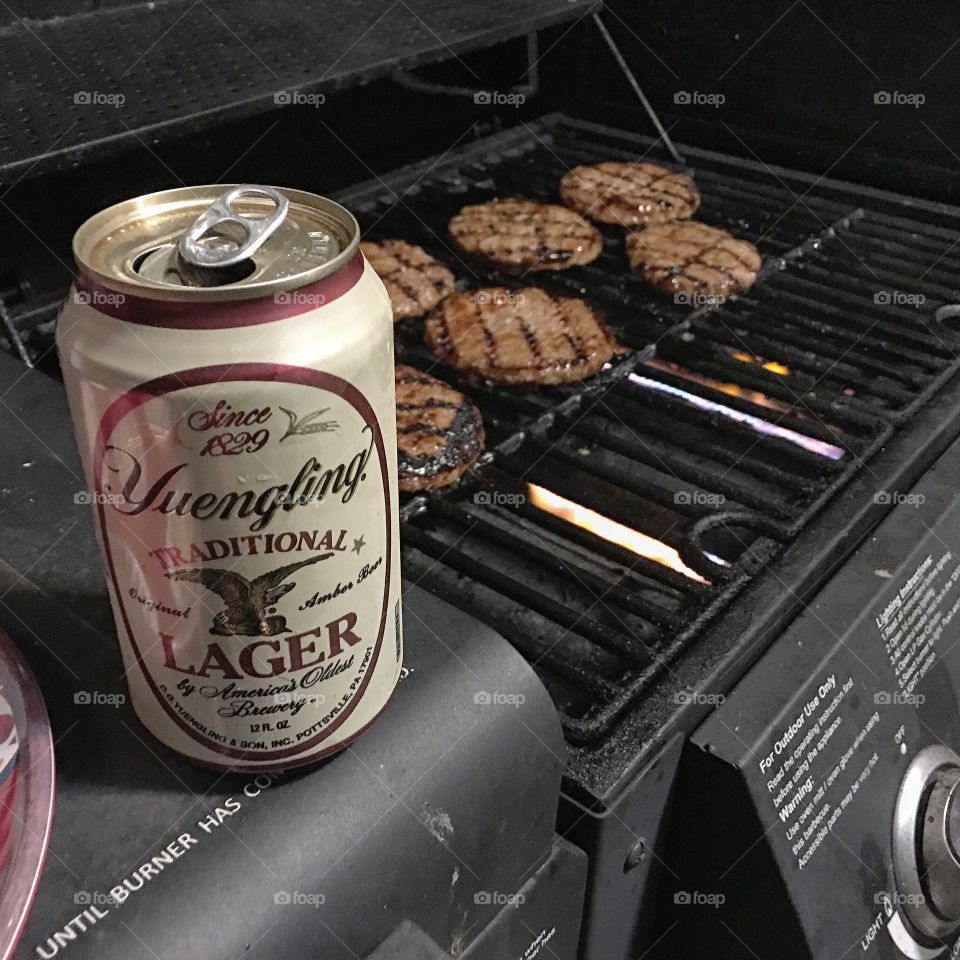 Drinking a Yuengling Lager while grilling up some burgers.