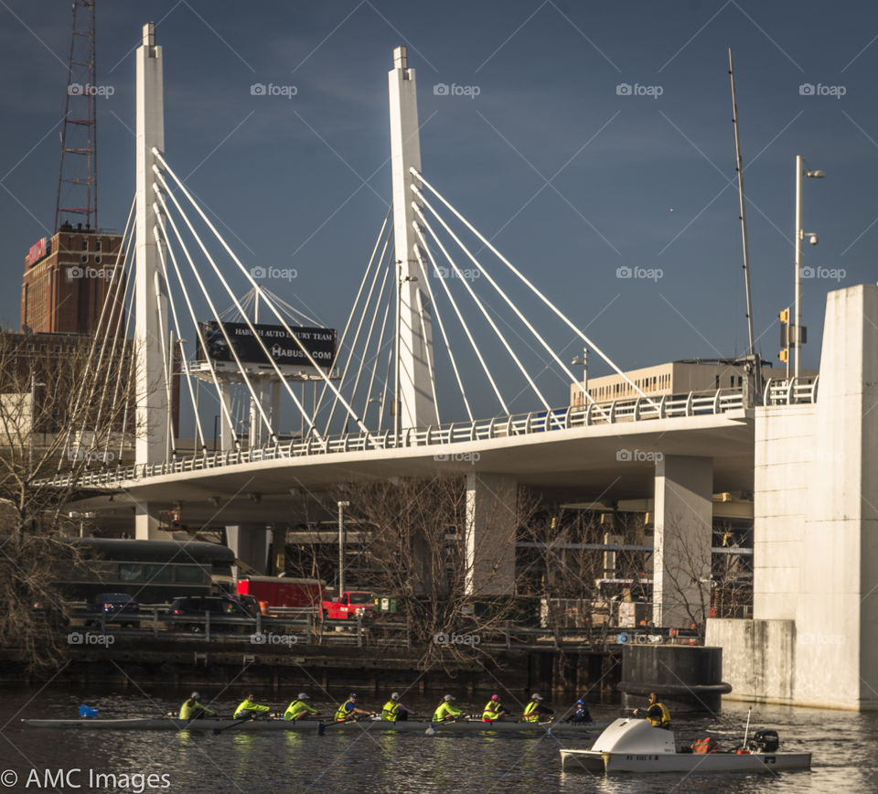 Crew team on Menomonee River in Milwaukee, Wisconsin. Crew team on the Menominee River in Milwaukee Wisconsin enjoying the spring warmth