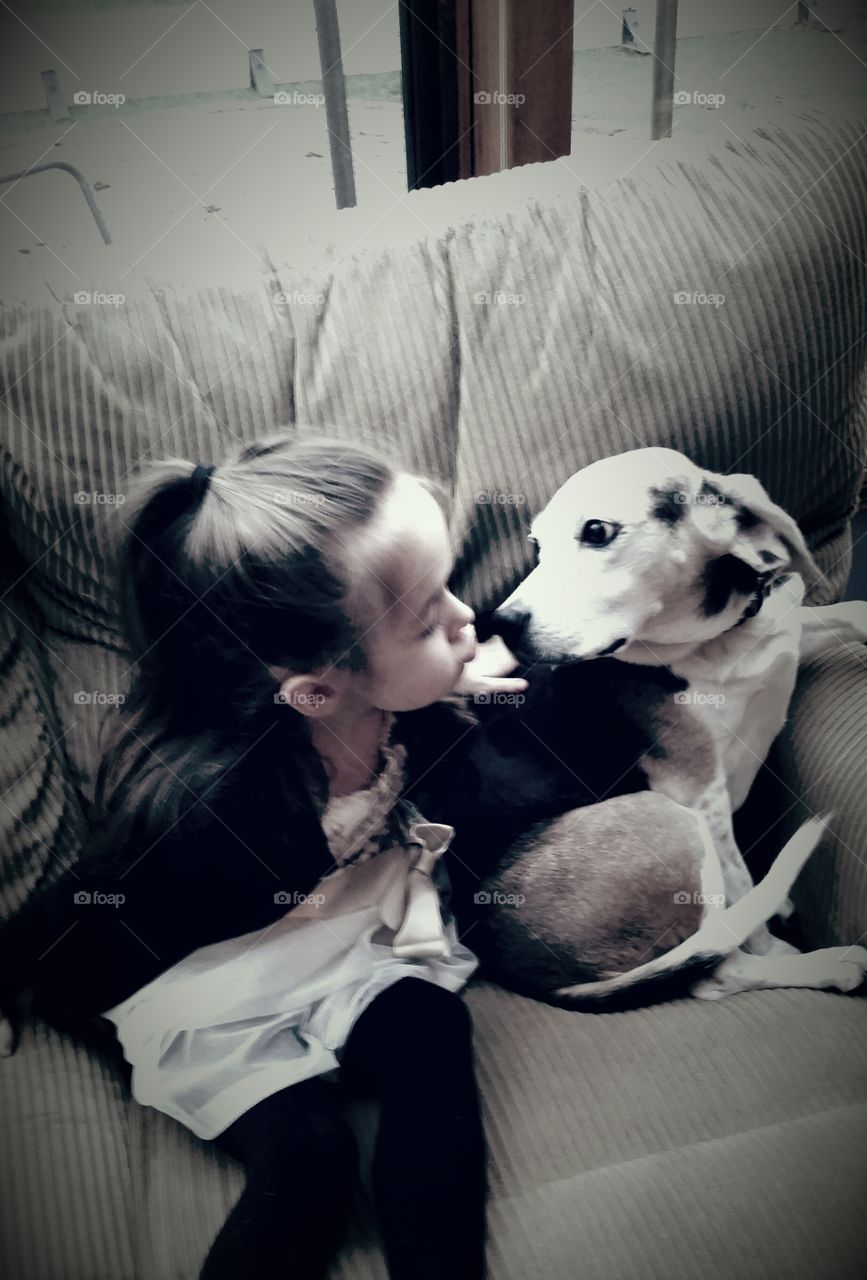 Beagle Kisses. My daughter,  kissing my cousin's Beagle. 