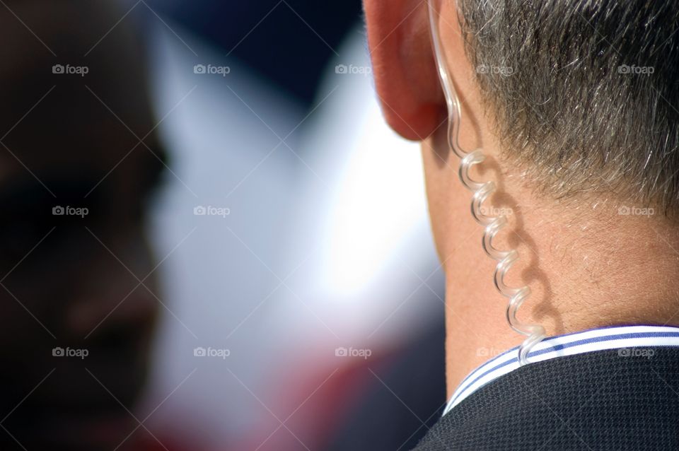 A secret service agents ear piece while protecting Vice President biden at a rally in 2008