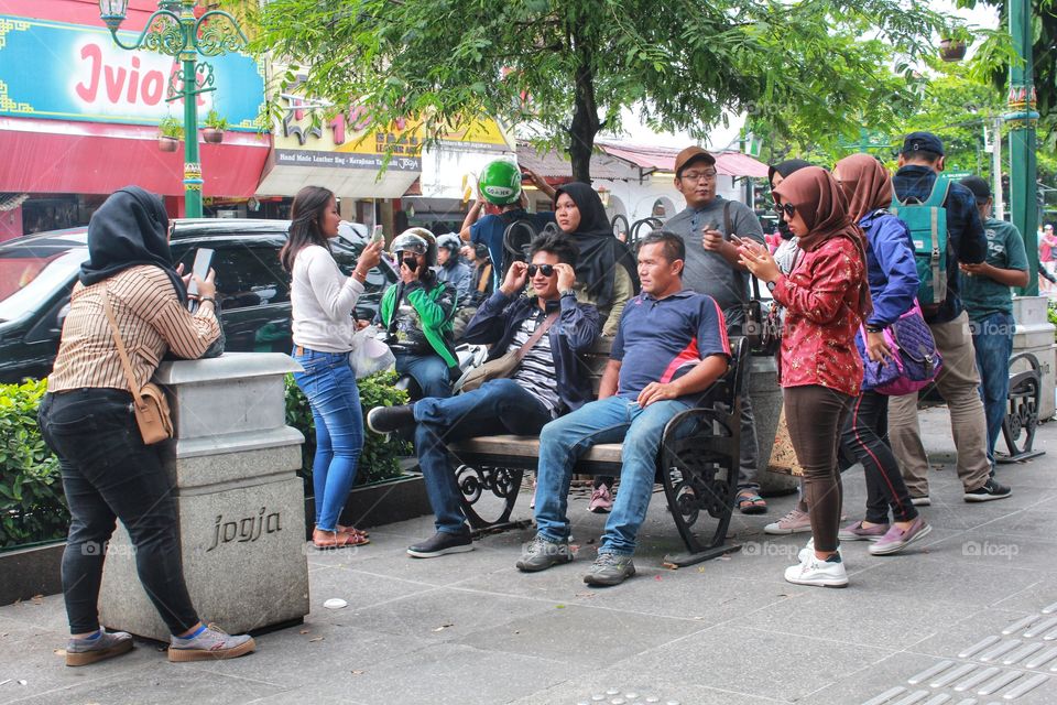 people take a photo together at Malioboro Yogyakarta