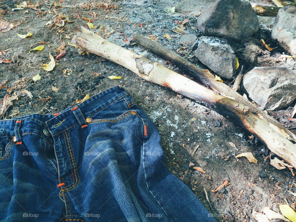 jeans lie near the extinct fire