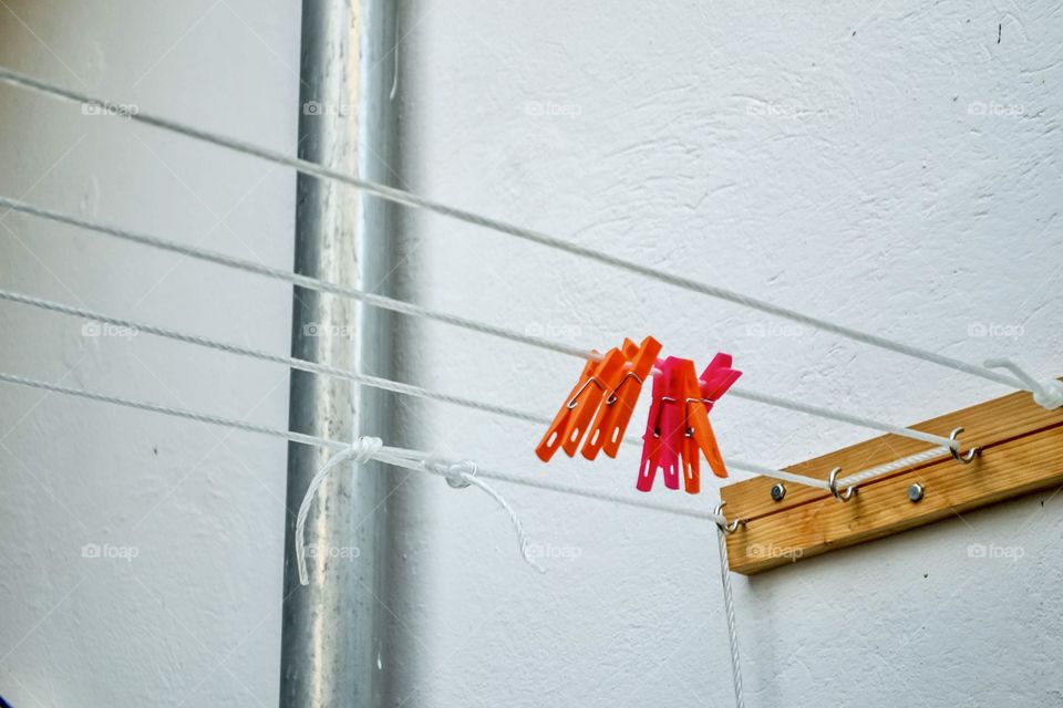 Colorful clothes nails on a clothesline