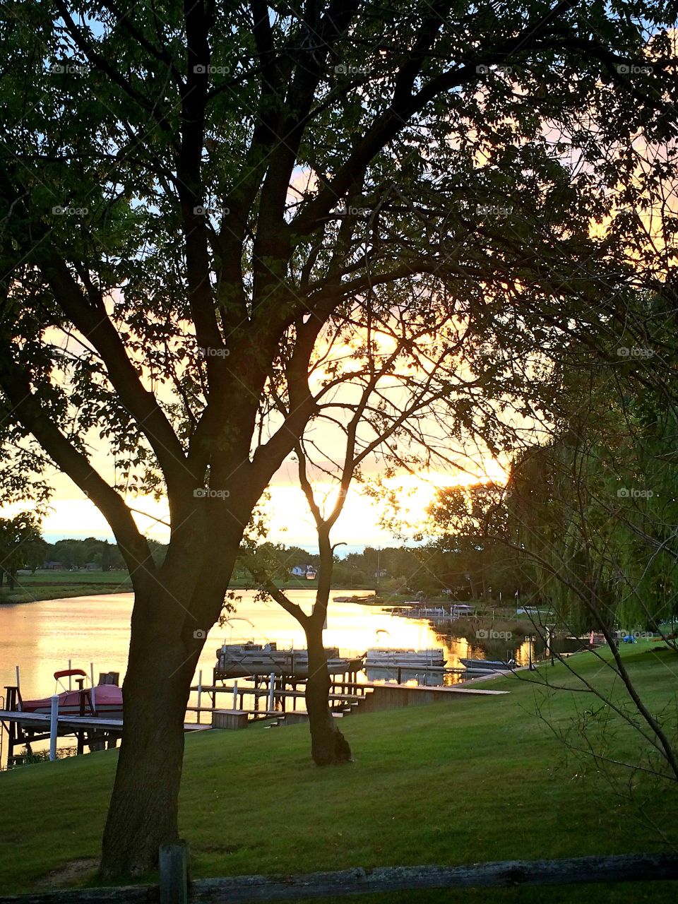 Scenic view of harbor during sunset