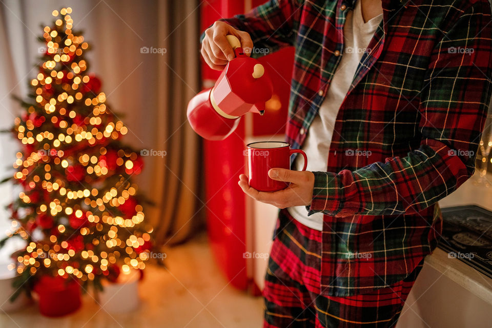 cup of coffee in a cozy festive Christmas atmosphere