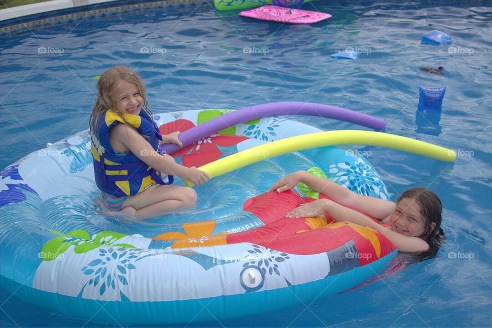 Girl enjoying in swimming pool