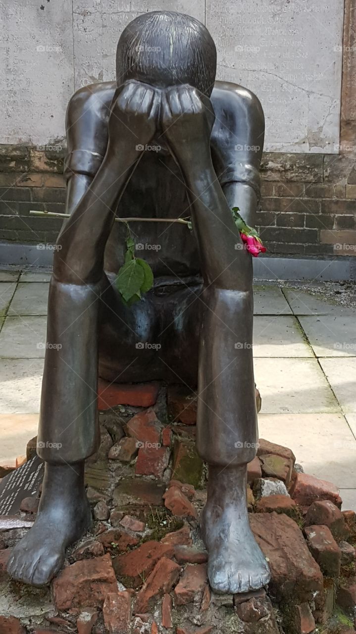 sad statue