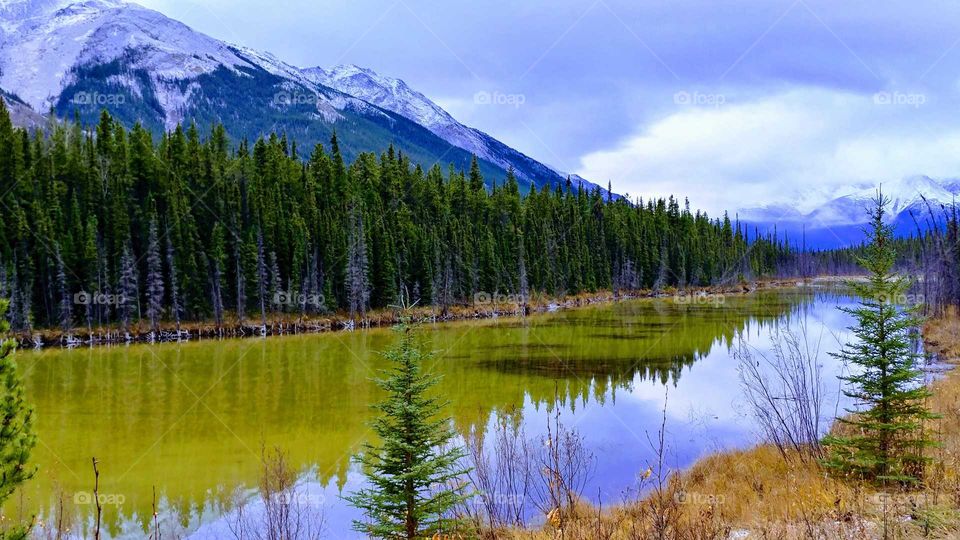 Emerald green waters of a high mountain lake deep in the heart of British Columbia.