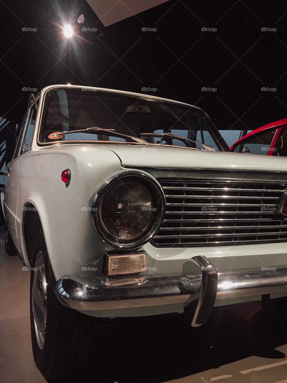 An old grey/green car in old car museum