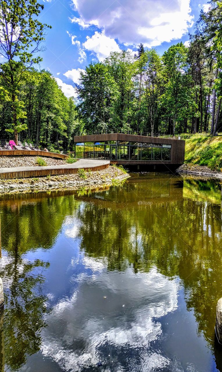 Clouds look into the river. (Lithuania, July, 2019.)