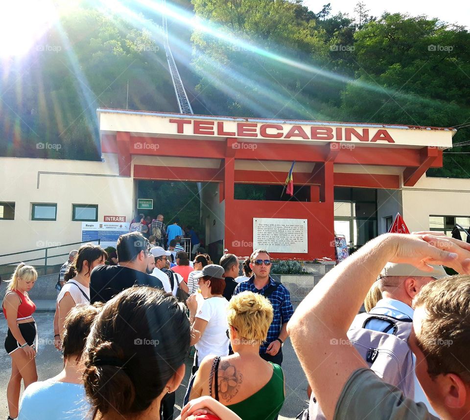 people waiting to take the cable car to Deva Fortress