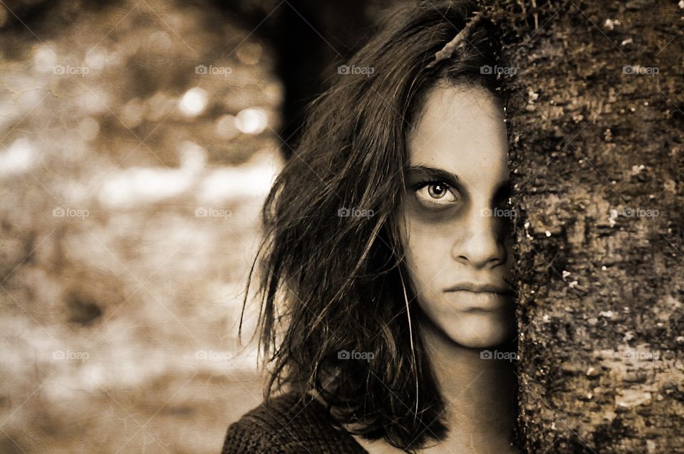 Portrait of a serious abuse young woman