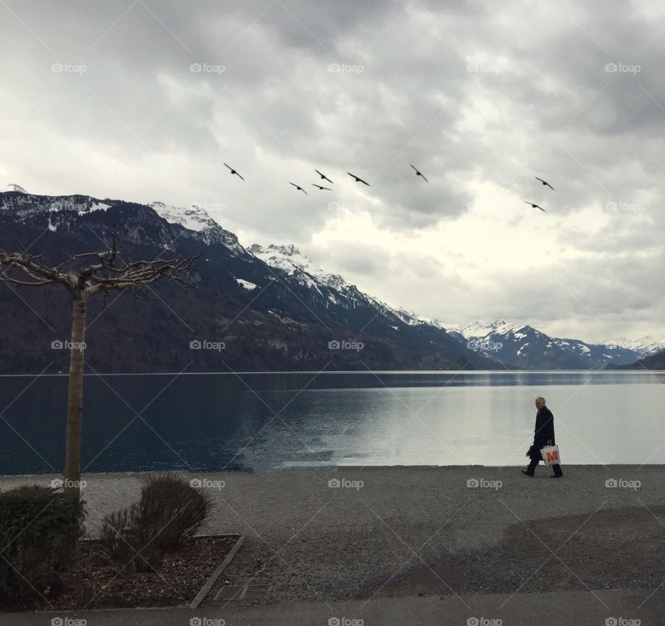 Man strolling by the lakeside 