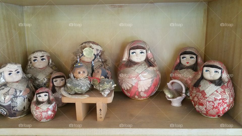 Japanese nesting dolls. Japanese dolls on a shelf