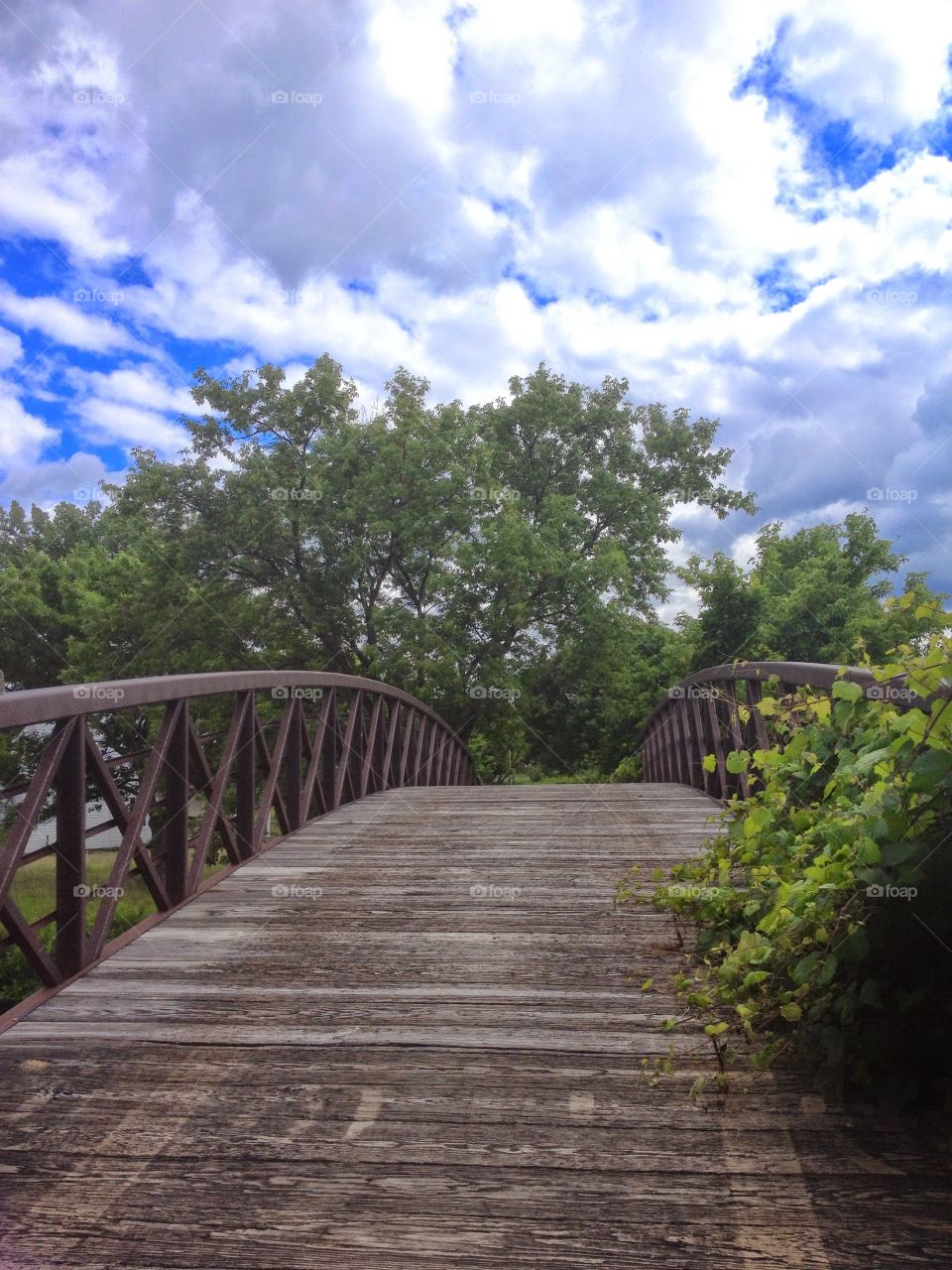 Wooden bridge, beautiful nature and clouds