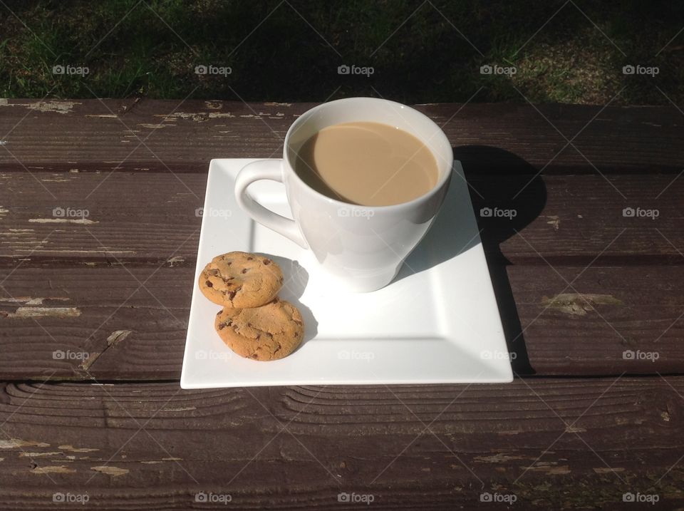 Enjoying a cup of coffee outdoors on a beautiful spring day.