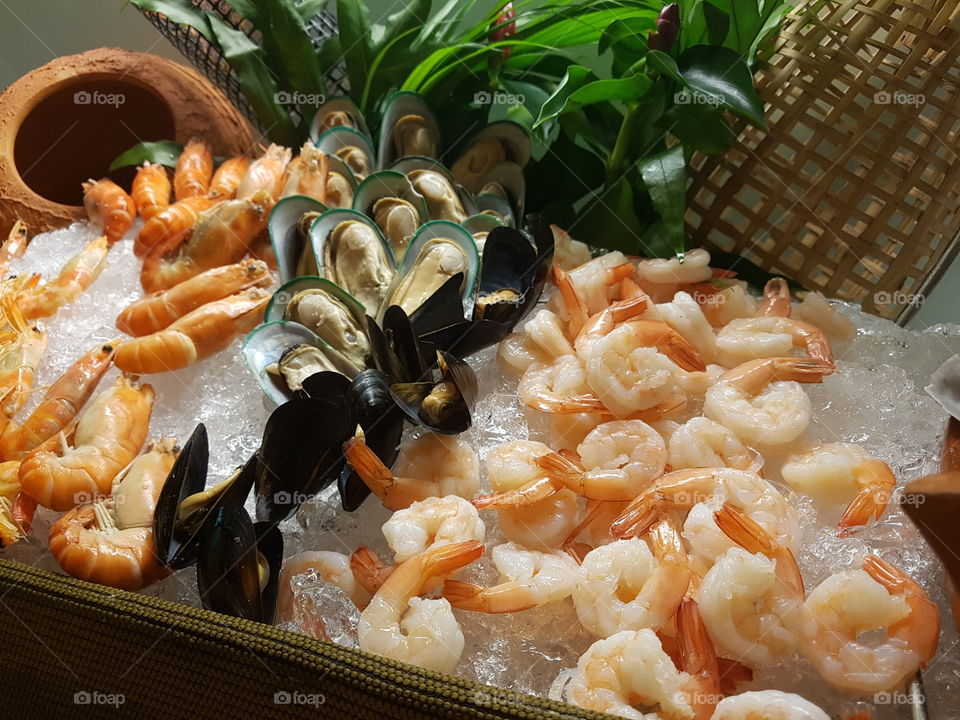 seafood buffet on ice display at a restaurant