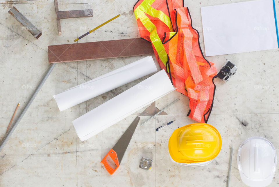 Paperwork and constructing tools on table