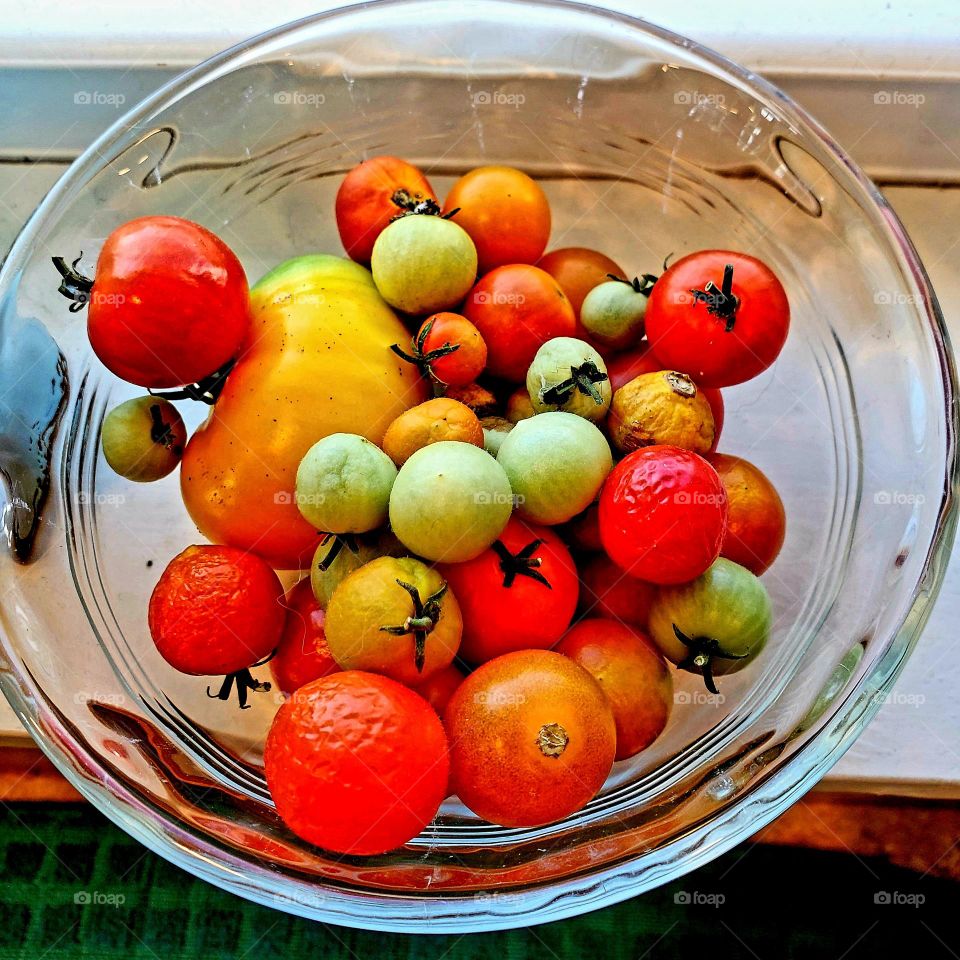 glass bowl with small, multi-colored tomatoes
