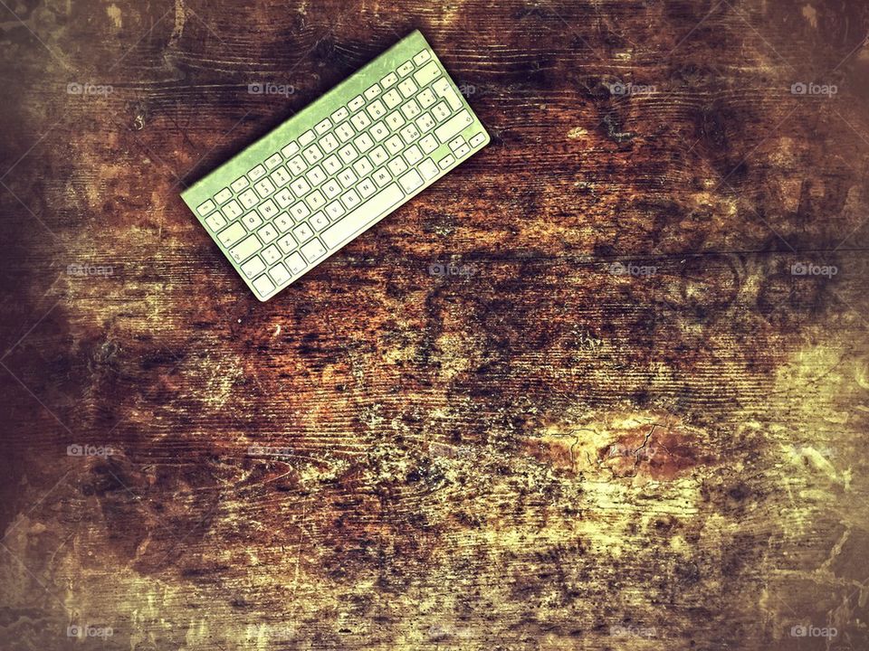 Keyboard on wooden rustic desk